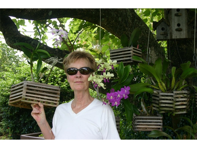 Sheila and her orchids in 2013